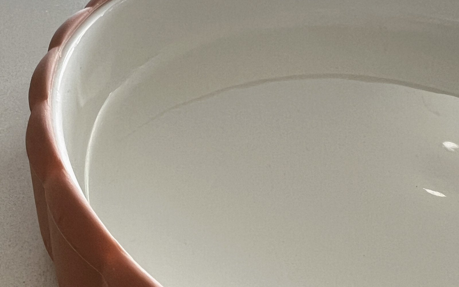 A ceramic insert plate with its sleeve pulled back