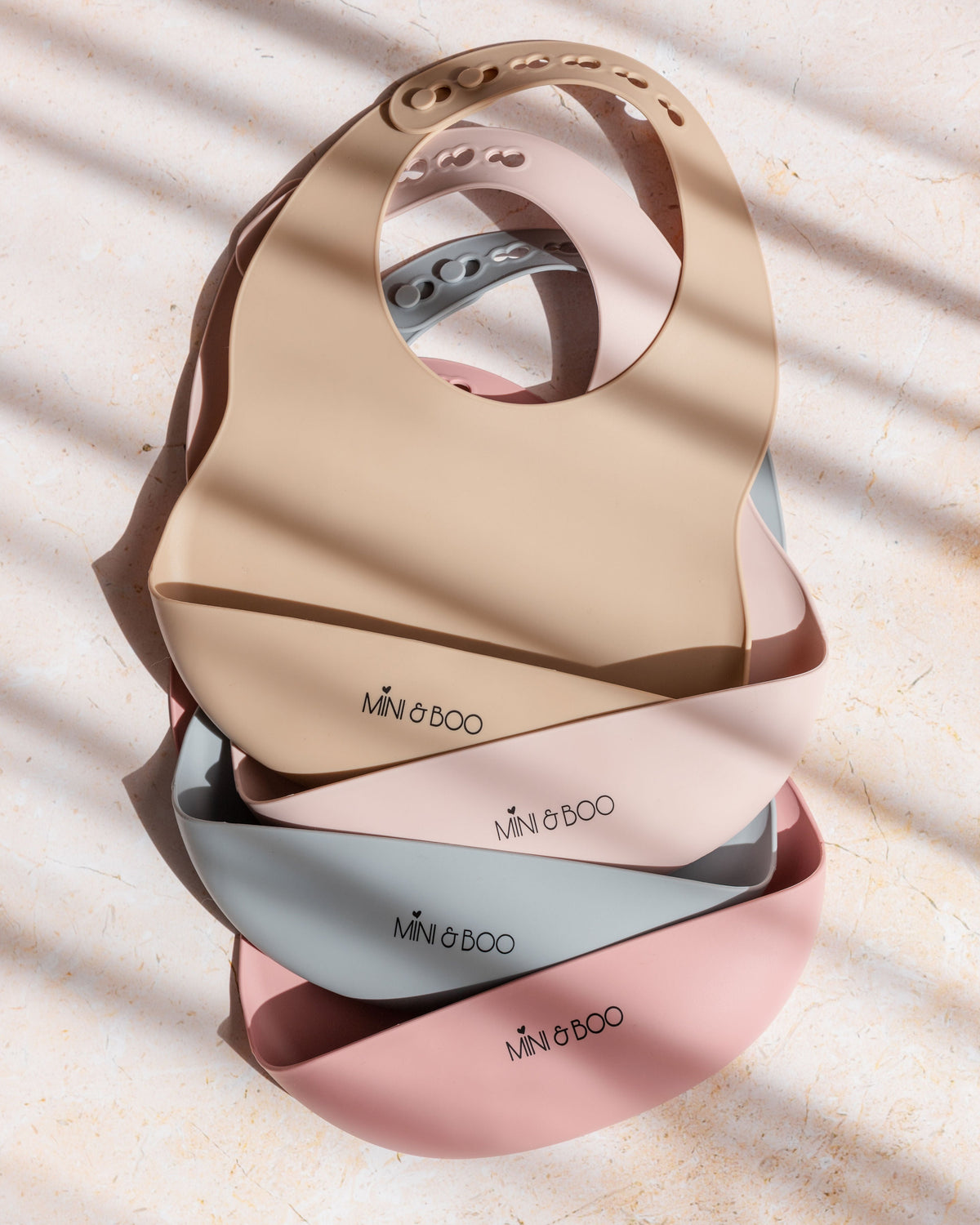 Mini and Boo silicone bib in rose pink – adjustable neck, deep food catcher pocket, BPA-free, dishwasher-safe toddler feeding accessory.