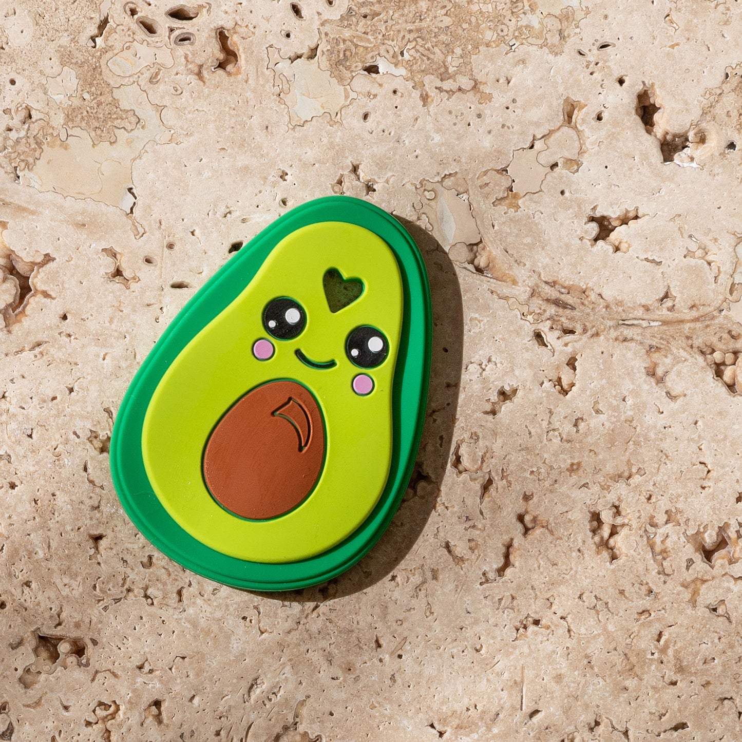 Mini and Boo banana teether made from food-grade silicone and beechwood – circular design with non-slip grip, naturally antibacterial, BPA and PVC free baby teether accessory.