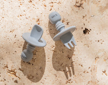 Load image into Gallery viewer, Mini and Boo BLW cutlery set with soft food-grade silicone fork and spoon, choke guard, baby-sized handles – BPA-free, dishwasher safe utensils for self-feeding babies.