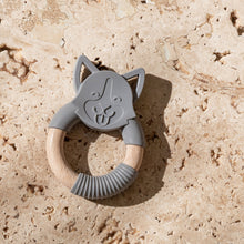 Load image into Gallery viewer, Mini and Boo dog-shaped teether made from food-grade silicone and beechwood – textured surface to soothe gums, antibacterial beechwood handle, BPA-free baby teething accessory.