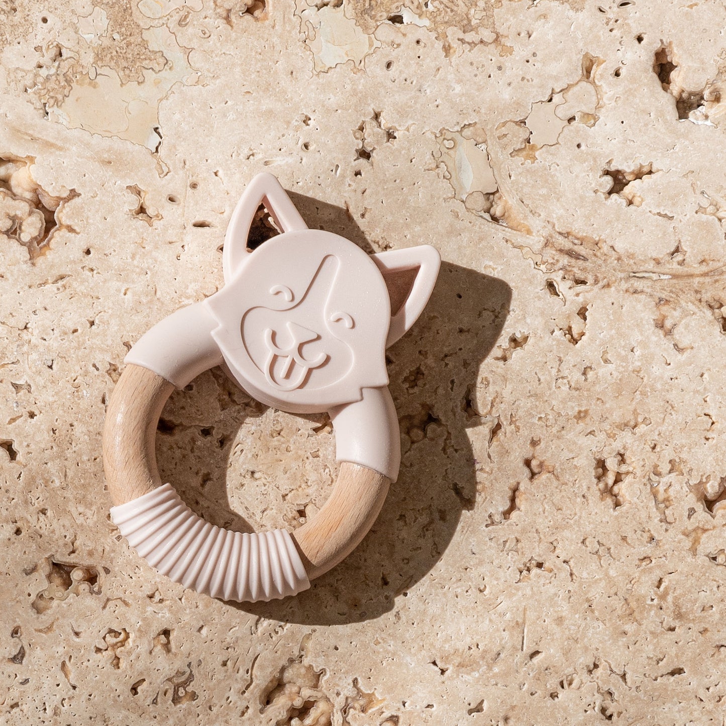 Mini and Boo dog-shaped teether made from food-grade silicone and beechwood – textured surface to soothe gums, antibacterial beechwood handle, BPA-free baby teething accessory.