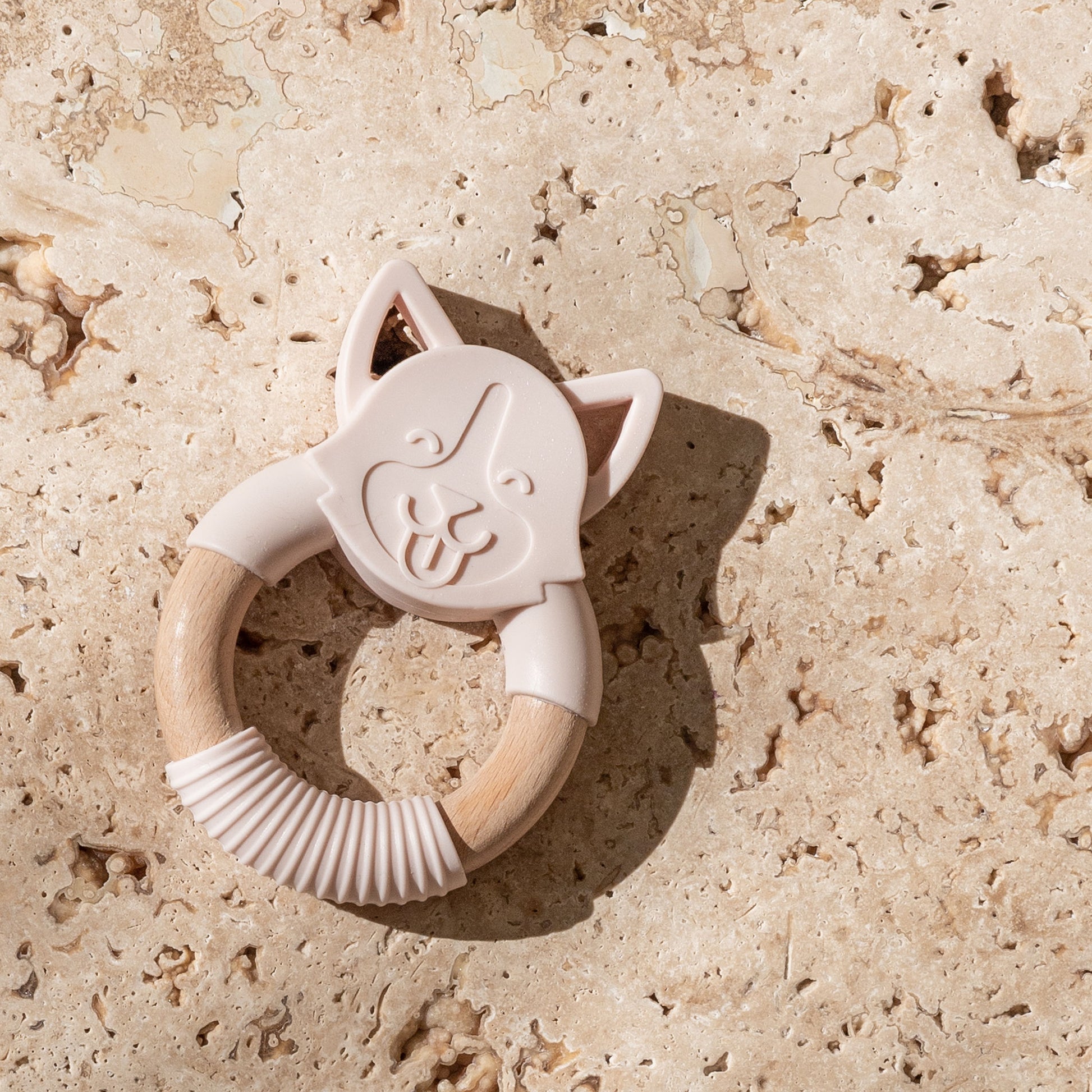 Mini and Boo dog-shaped teether made from food-grade silicone and beechwood – textured surface to soothe gums, antibacterial beechwood handle, BPA-free baby teething accessory.