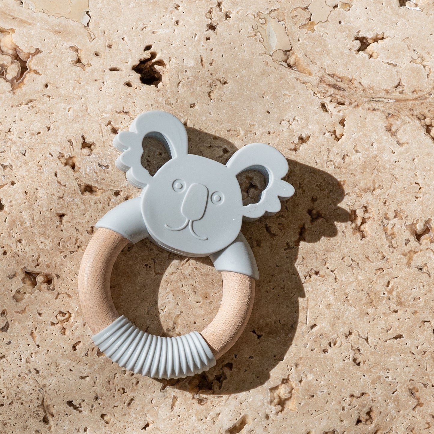 Mini and Boo koala-themed teether in food-grade silicone and beechwood – gentle texture for gum relief, natural antibacterial wood, BPA-free and safe for self-soothing babies.