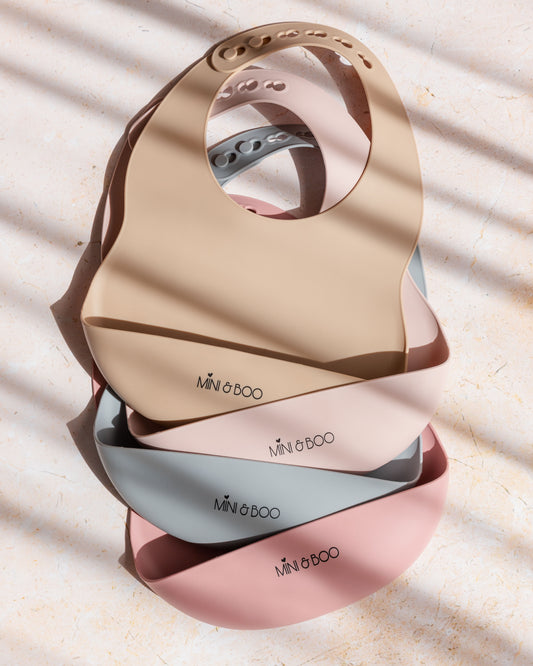 Mini and Boo silicone bib in rose pink – adjustable neck, deep food catcher pocket, BPA-free, dishwasher-safe toddler feeding accessory.