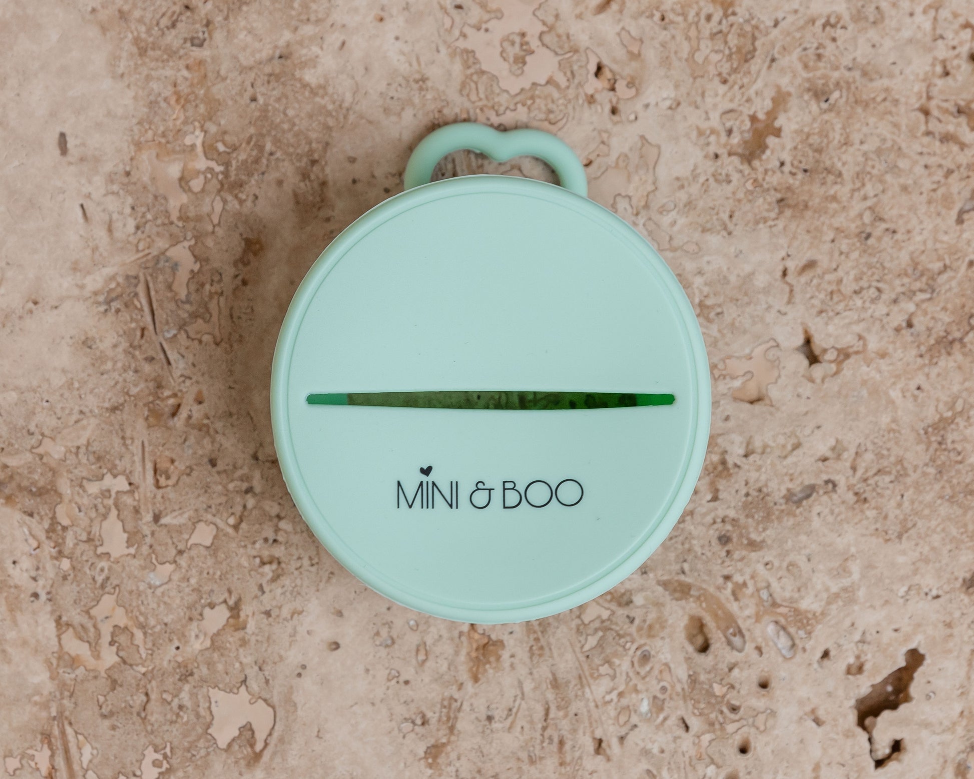 Mini and Boo snack lid made from soft food-grade silicone – spills-proof stretch lid with non-slip handle, fits up to 10 cm diameter cups, BPA-free, lead-free, phthalate-free toddler snack accessory.