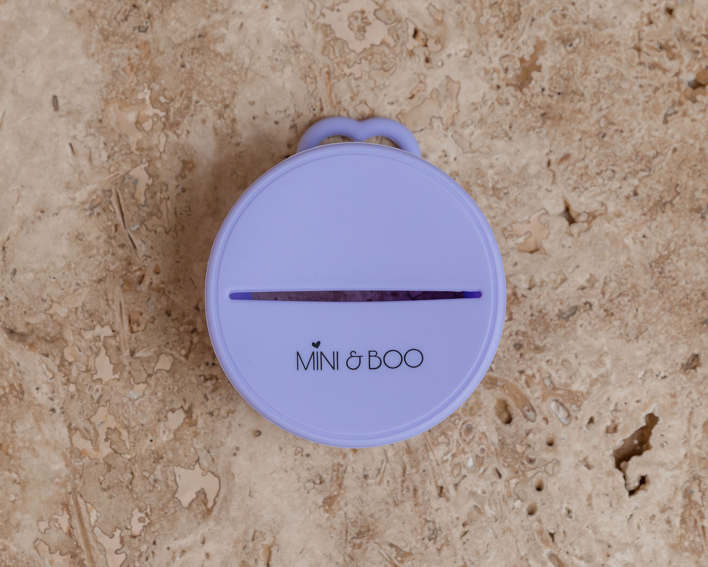 Mini and Boo snack lid made from soft food-grade silicone – spills-proof stretch lid with non-slip handle, fits up to 10 cm diameter cups, BPA-free, lead-free, phthalate-free toddler snack accessory.